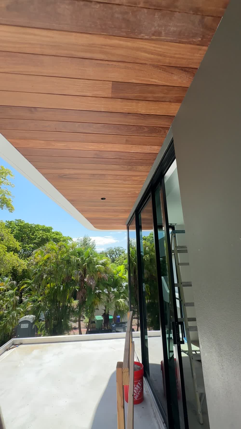 Wood soffit extending from the interior out over the terrace